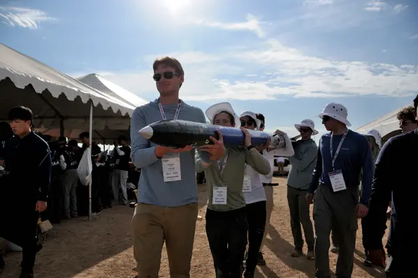 Team Members Carrying Rocket at competition