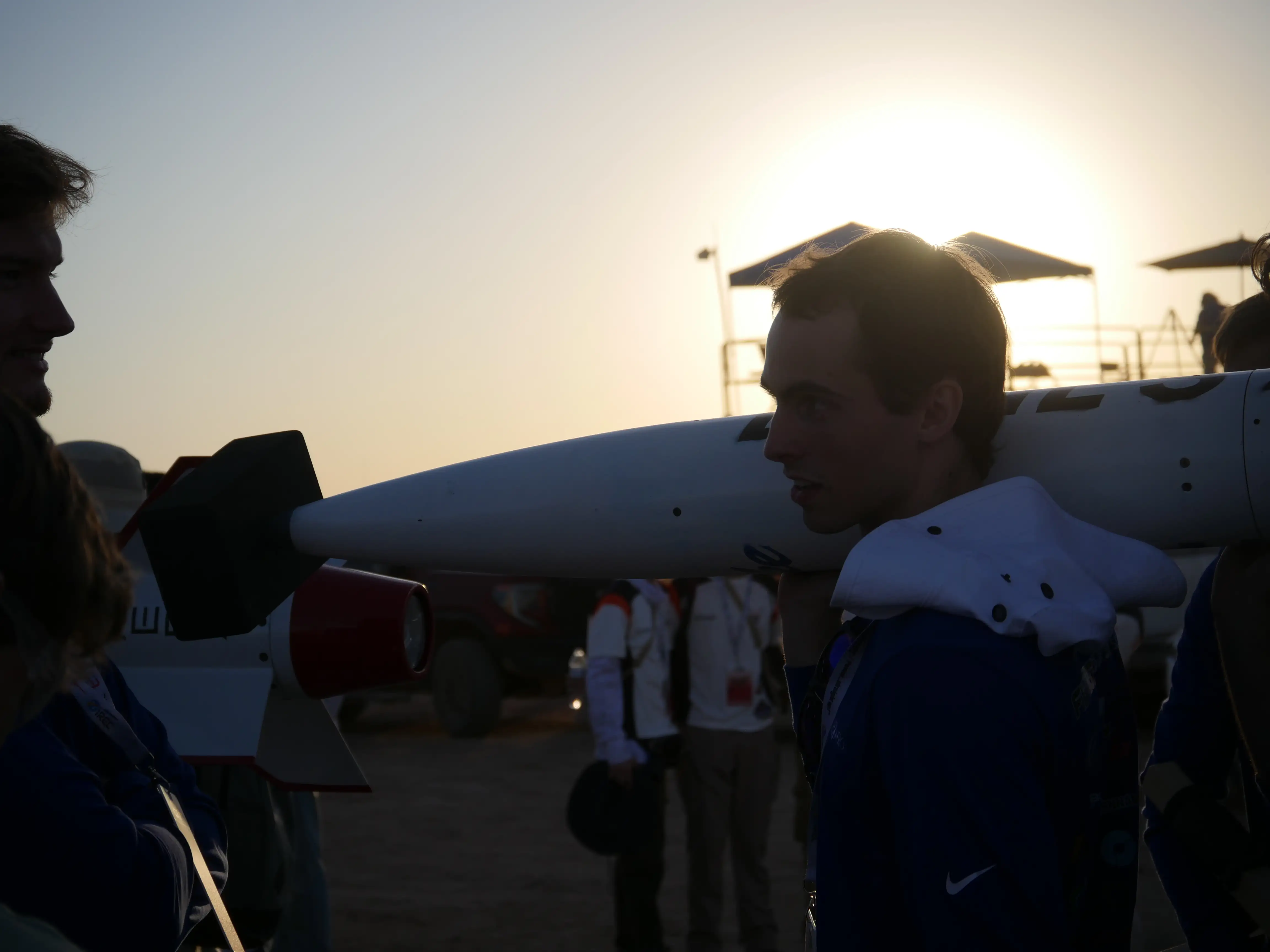 Team Member Carrying Rocket at competition